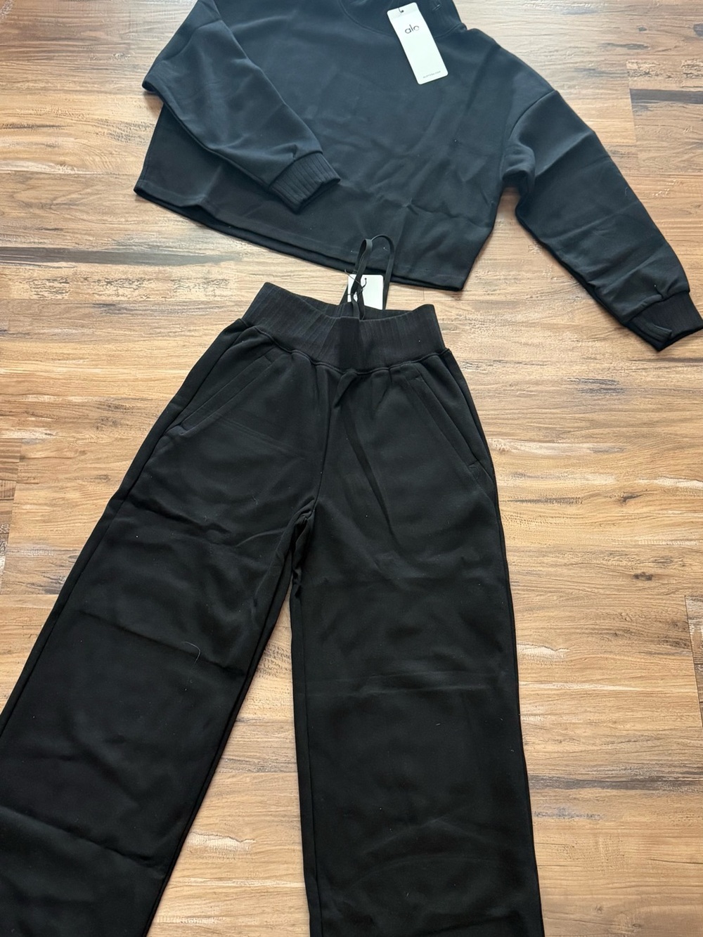 ALO Yoga Black Wide-Leg Track Pants with Drawstring Waist set.